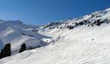 Chairlift, in the upper right corner Kitzbüheler Horn with its pole